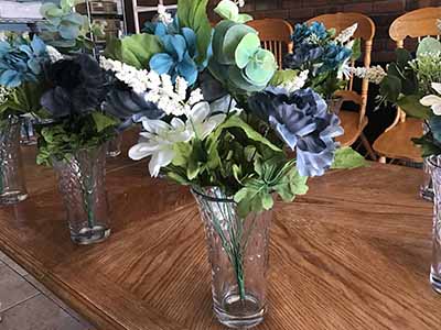 box of plastic/silk flowers