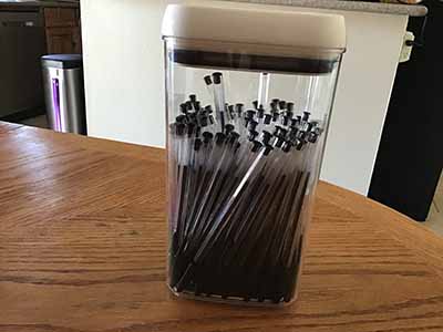 pens (100 black ink pens in container)