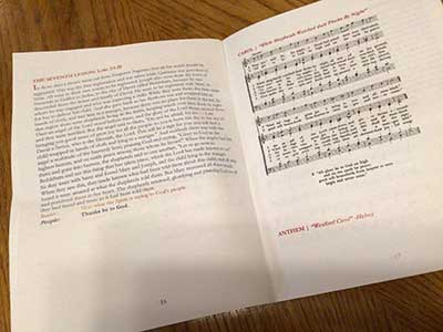 printed program, open to a page with Christmas hymn
