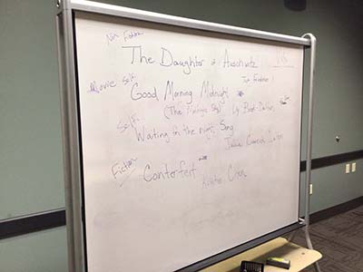 white board discussing next month's book club selection