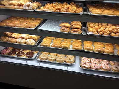 doughnuts behind glass at Bosa Donuts