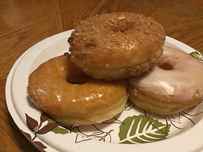 3 doughnuts on a plate