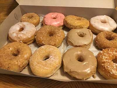 one dozen doughnuts in a box