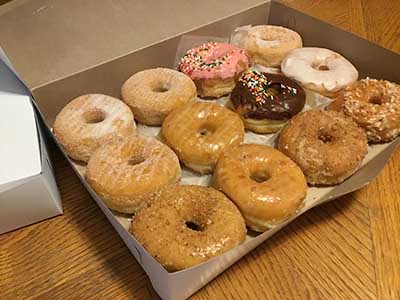 one dozen doughnuts in a box