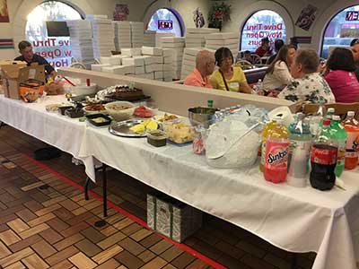 food on table with people in background