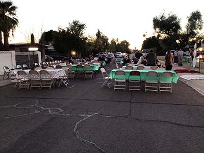 tables and chairs set up for neighborhood event