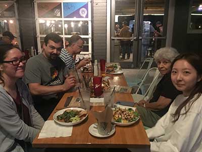 people in neighborhood potluck group gathered for dinner at Spokes on Southern restaurant