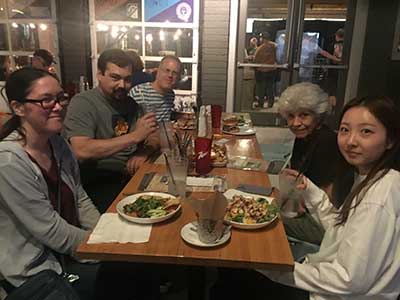 people in neighborhood potluck group gathered for dinner at Spokes on Southern restaurant