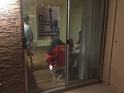 Cash is Freedom sign on outside window