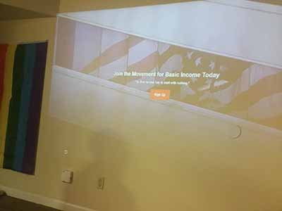 Slide projected onto wall: Join movement for basic income