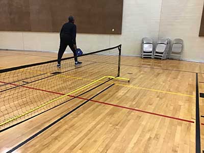 neighbors playing pickleball