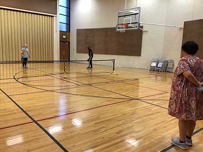 neighbors playing pickleball