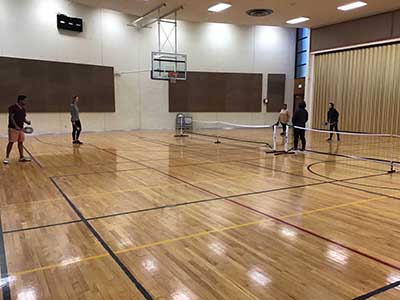 neighbors playing pickleball