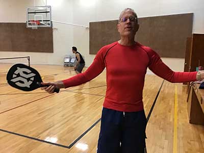 neighbors playing pickleball