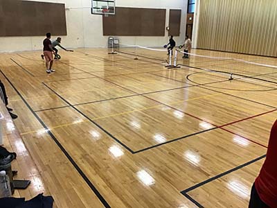 neighbors playing pickleball