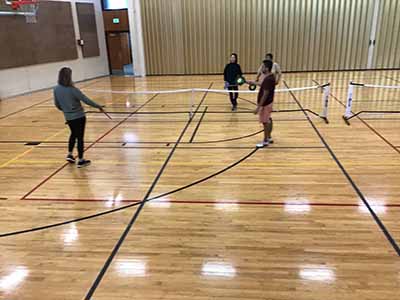 neighbors playing pickleball