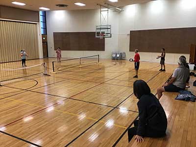 neighbors playing pickleball