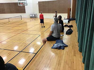 neighbors playing pickleball