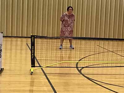 neighbors playing pickleball