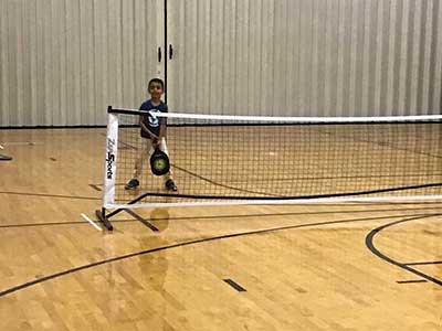 neighbors playing pickleball