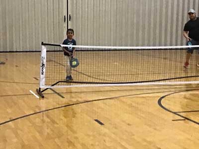 neighbors playing pickleball