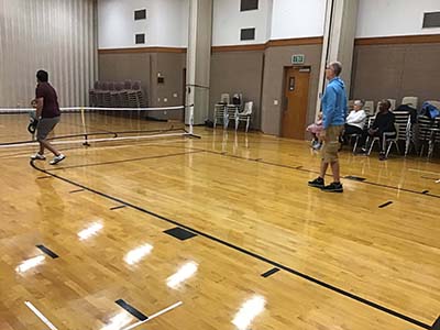 neighbors playing pickleball