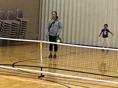 neighbors playing pickleball