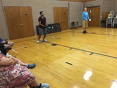 neighbors playing pickleball