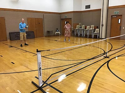 neighbors playing pickleball