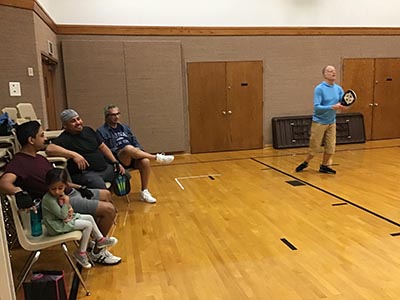 neighbors playing pickleball