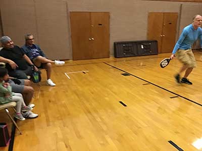 neighbors playing pickleball