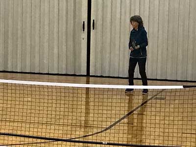 neighbors playing pickleball