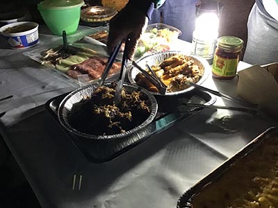 food on table at potluck dinner