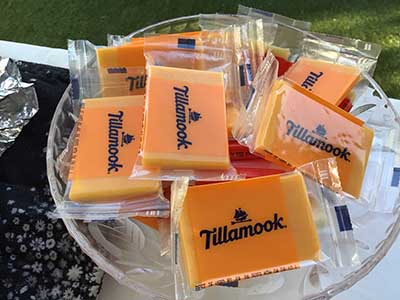 Tillamook individually packaged cheeses in serving bowl on food serving table