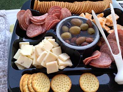 crackers, cheese, meat (sausage) on tray