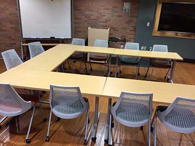 tables and chairs arranged for book club meeting