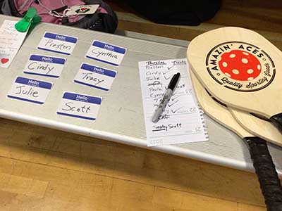 nametags and pickleball paddles