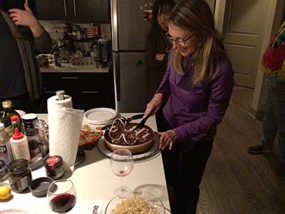 Tracy cutting birthday cake