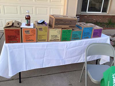 Girl Scout cookies for sale on table