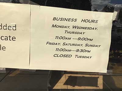 Tao Garden restaurant business hours sign