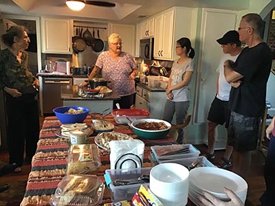 people at potluck dinner