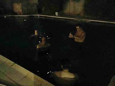 people in pool at potluck dinner