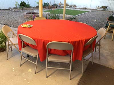 round table with red tablecloth