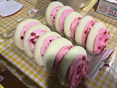 sugar cookies with pink frosting and sprinkles