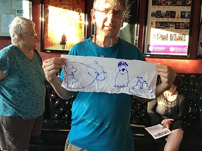 Gary showing a sketch for a sculpture