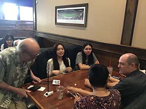 neighbors at welcome dinner for ESL students from Japan