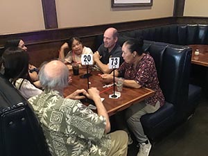 neighbors at welcome dinner for ESL students from Japan