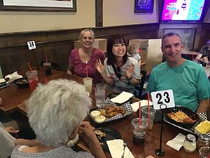 neighbors at welcome dinner for ESL students from Japan