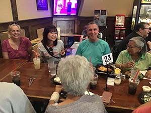 neighbors at welcome dinner for ESL students from Japan