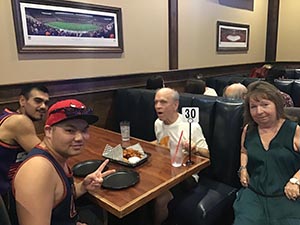 neighbors at welcome dinner for ESL students from Japan